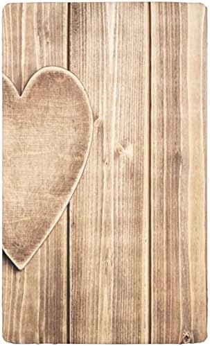 Coração rústico sobre tábuas de madeira com tema de fundo folhas de berço, lençóis portáteis de mini berço para crianças colchões