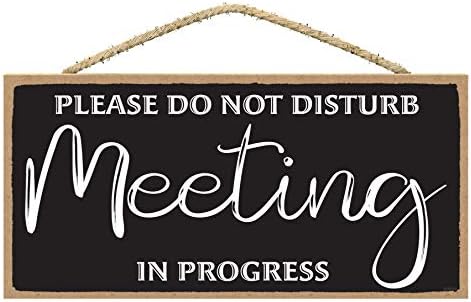 Não perturbe a reunião no progresso Sinal da porta - em uma placa da porta da reunião para o escritório da porta do escritório - Sinal