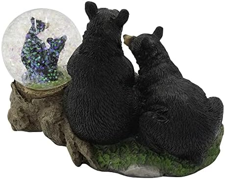 2 ursos negros admirando lá o globo de neve favorito